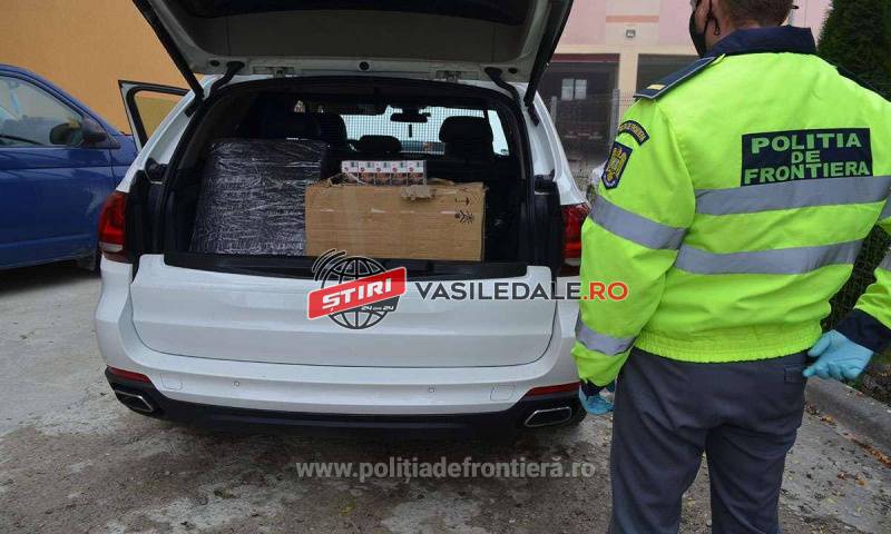 FOTO/VIDEO: Maramureșean prins cu țigări de contrabandă, un pistol Glock, sume de bani în lei și valută, toate ascunse într-un BMW